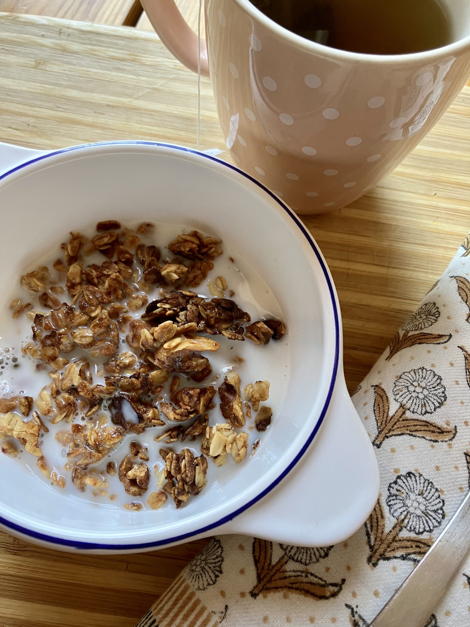 banana nut crunch granola in a bowl with milk