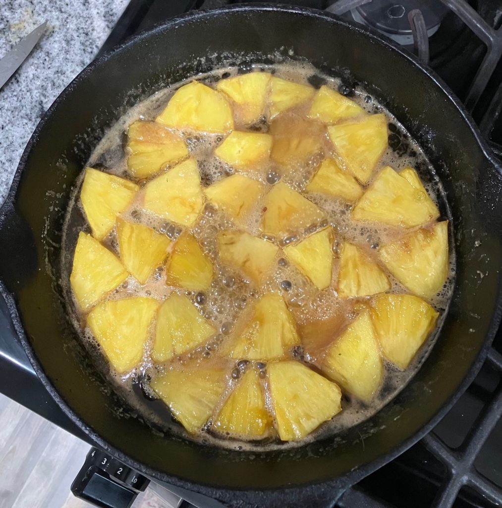 caramelizing pineapples in a cast iron skillet