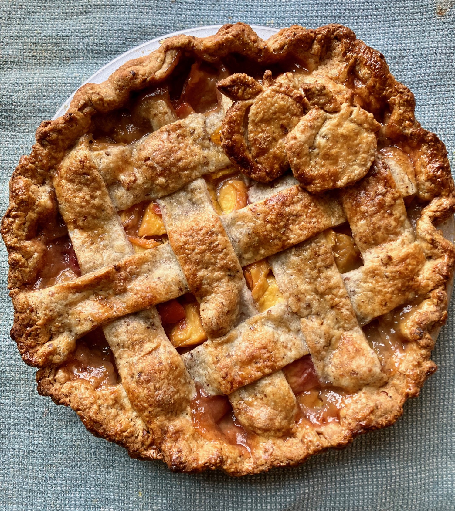 Bourbon peach pie on a dish cloth