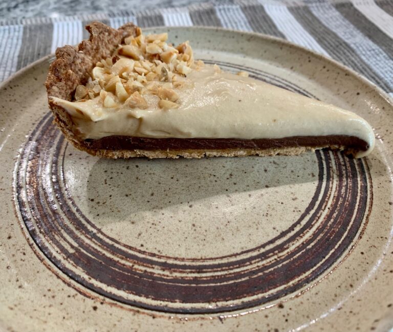 slice of hazelnut chocolate tart on a plate