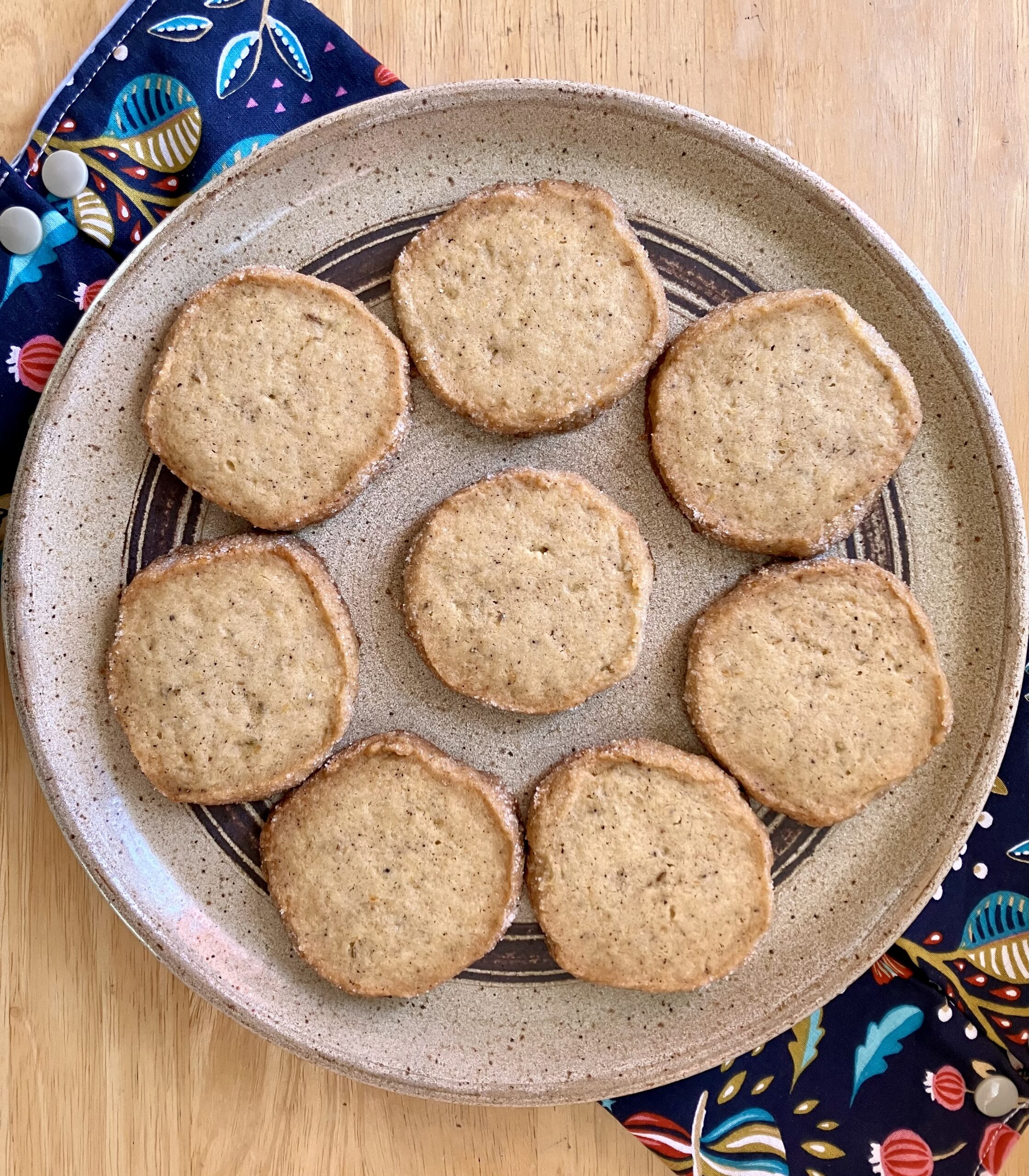 Honey sables with grapefruit and fennel arranged in a circle on a plate