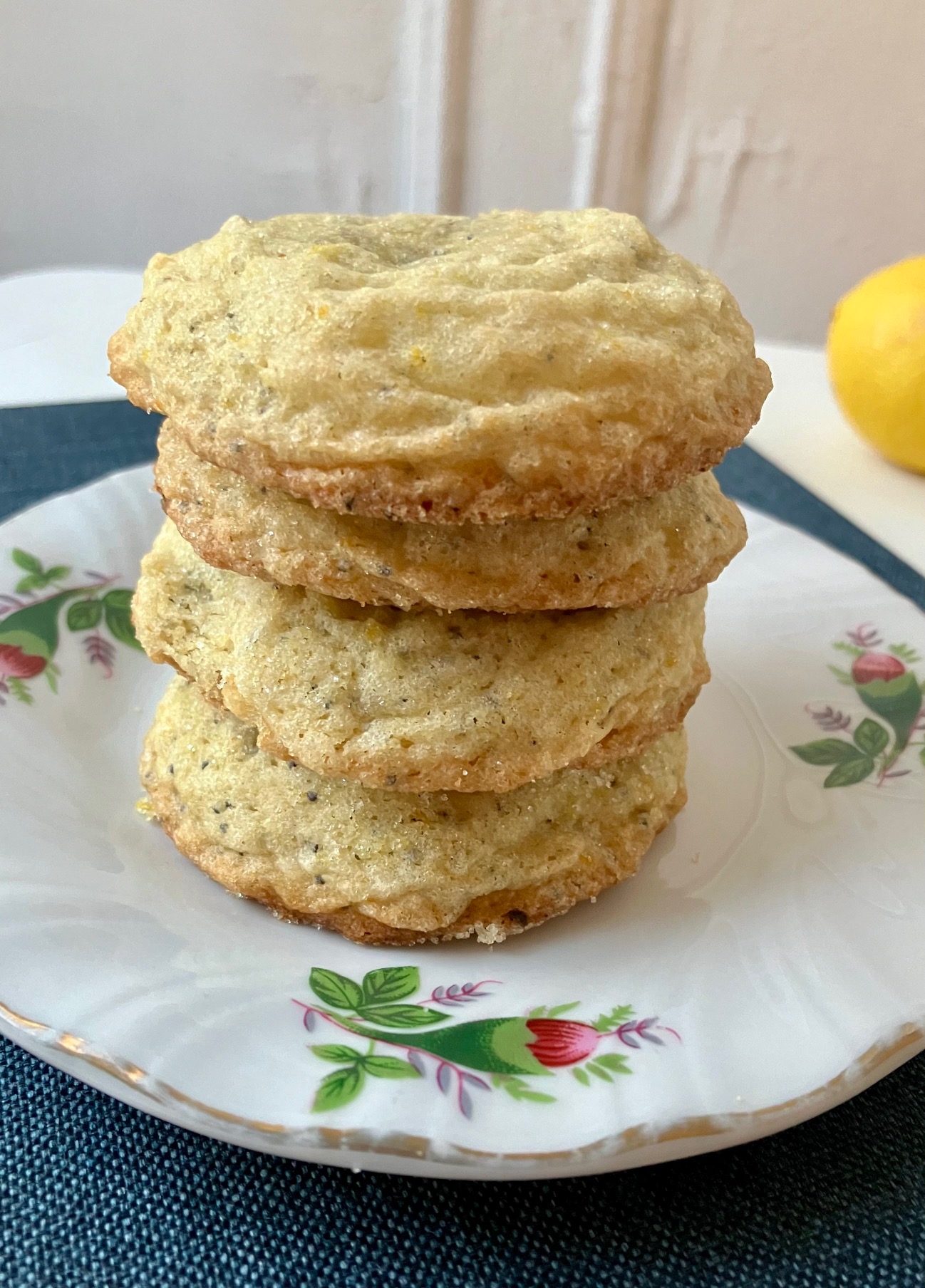 preserved lemon poppy seed cookies stacked on a plate