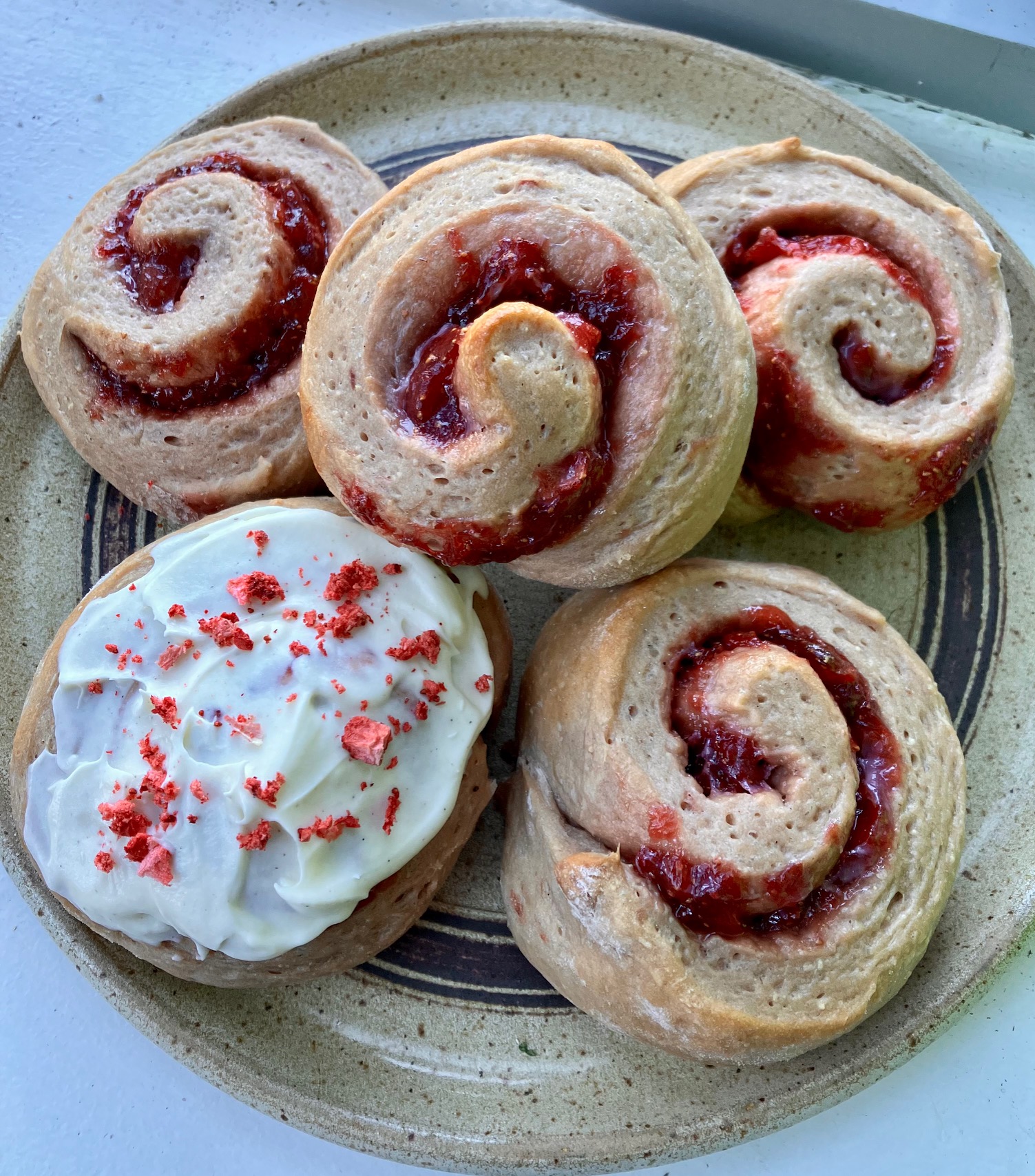 roasted strawberry buns arranged on a plate