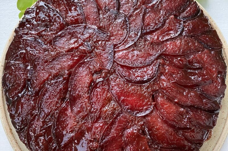 Caramelized honey and plum upside down cake on a plate